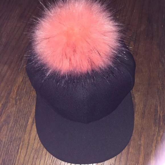 baseball cap with puffball